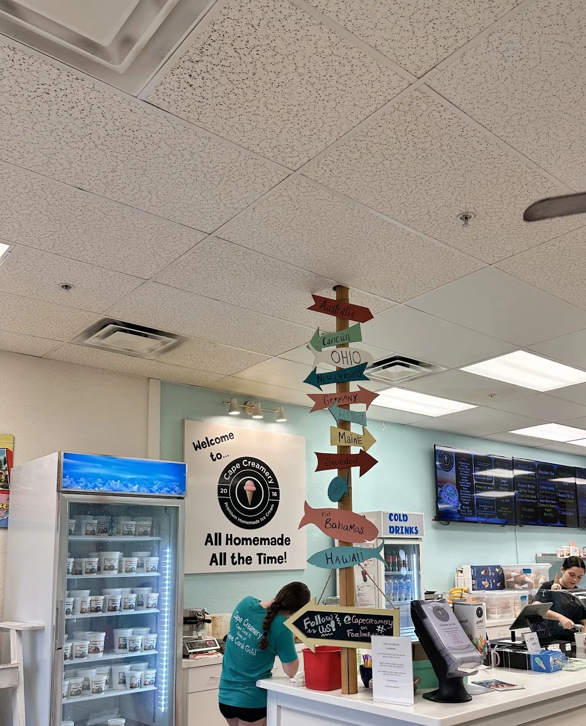 Wooden signpost inside the shop